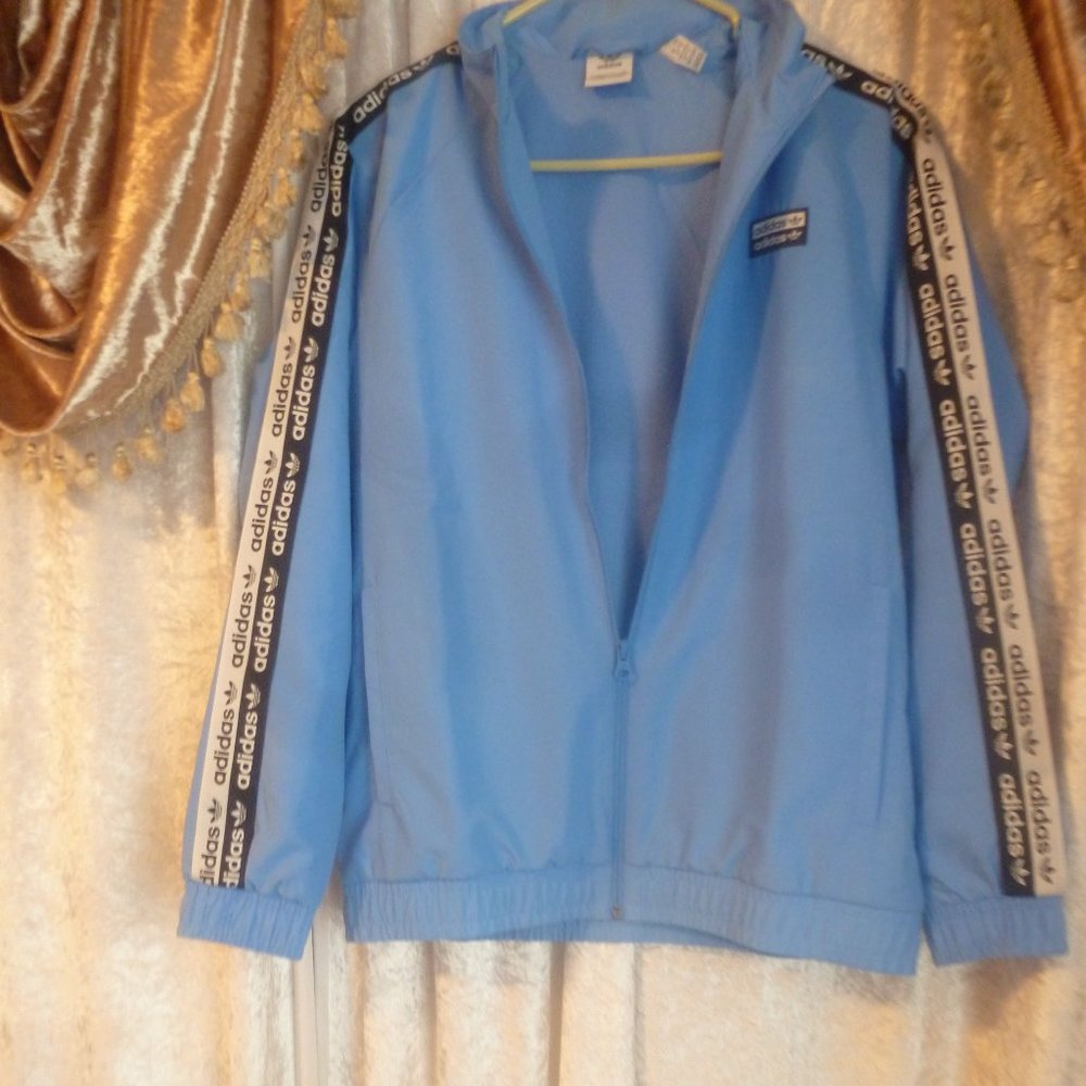 Sale- Adidas Regular fit Essential Lined Windbreaker w/ Logo strips on sleeves…